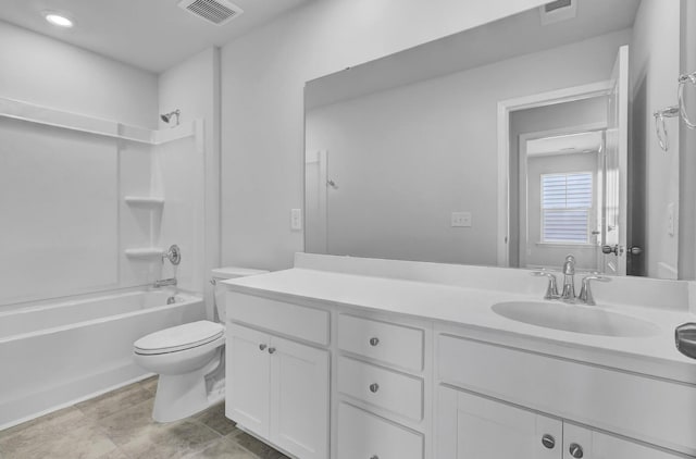 full bath featuring toilet, tub / shower combination, vanity, and recessed lighting