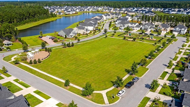 aerial view of residential area with a nearby body of water