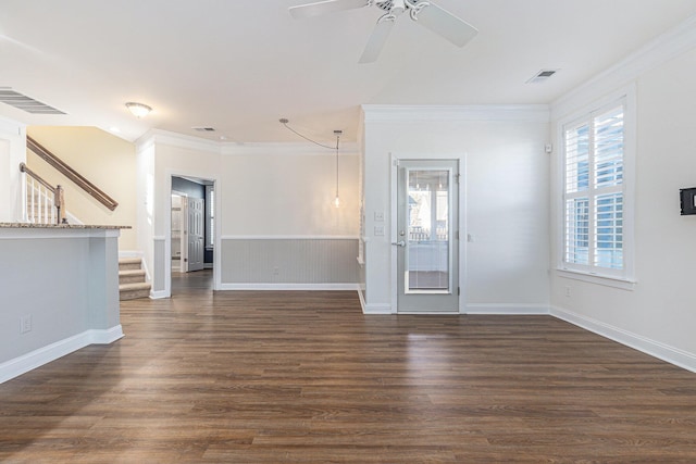 unfurnished living room featuring ceiling fan, crown molding, and dark hardwood / wood-style flooring