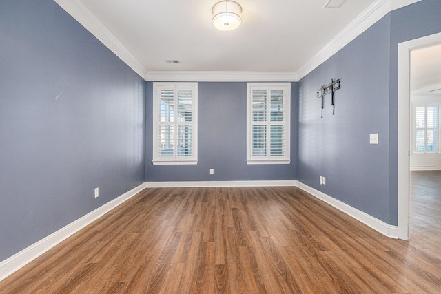 unfurnished room with hardwood / wood-style floors and ornamental molding