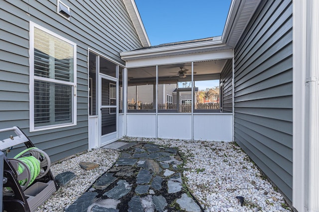 view of patio / terrace featuring a sunroom and ceiling fan