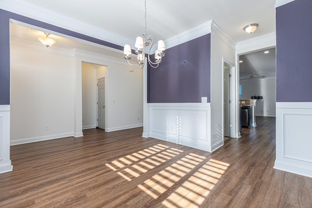 unfurnished dining area featuring a notable chandelier, ornamental molding, and dark hardwood / wood-style flooring