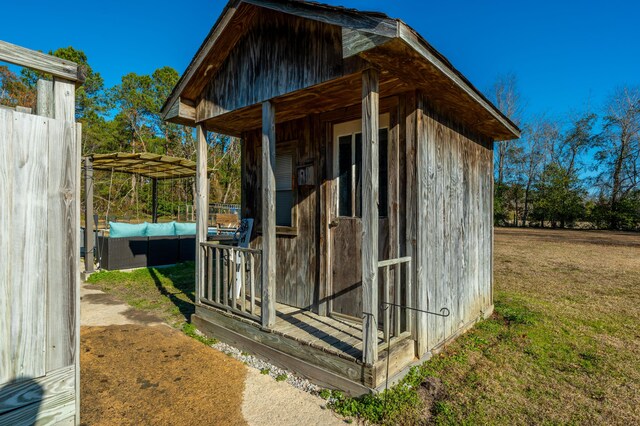 view of outbuilding featuring a yard