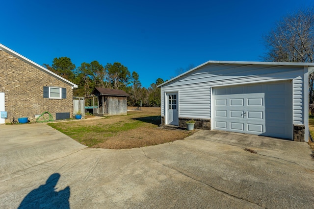 garage featuring a yard