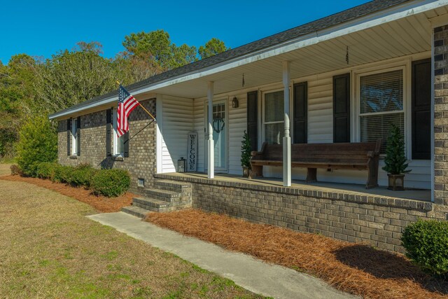 entrance to property with a porch