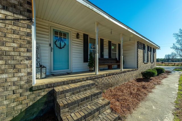 property entrance featuring covered porch