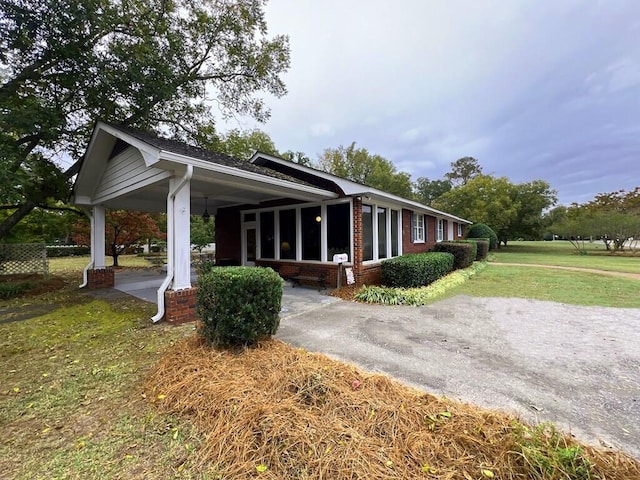 view of home's exterior with a lawn