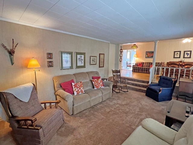 carpeted living room with ornamental molding