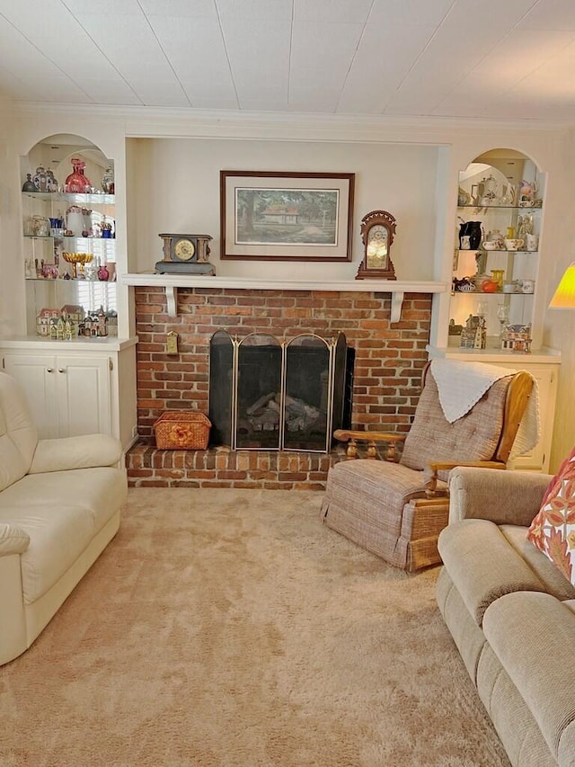 living room featuring a fireplace, carpet flooring, and ornamental molding