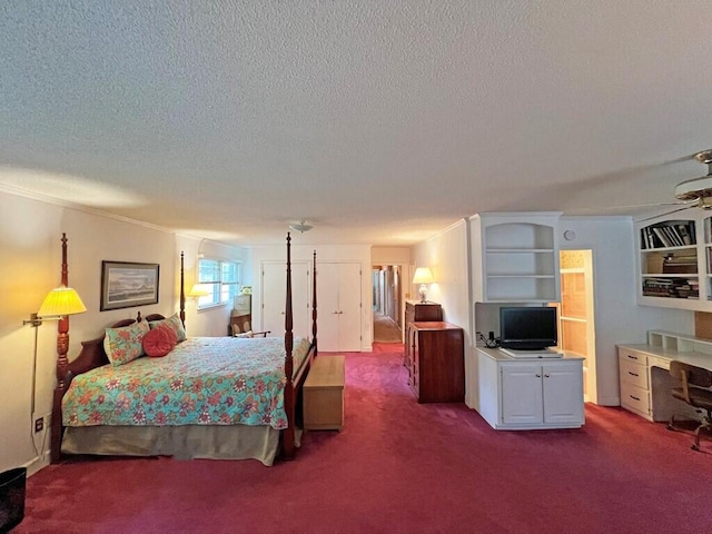 bedroom with carpet, a textured ceiling, and ornamental molding