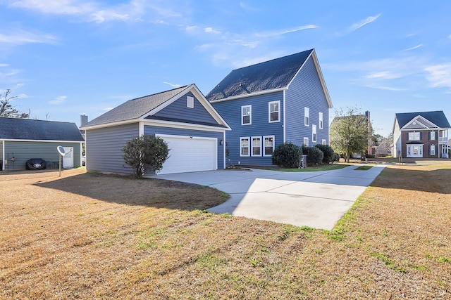 view of front of home featuring a front yard, an attached garage, and driveway