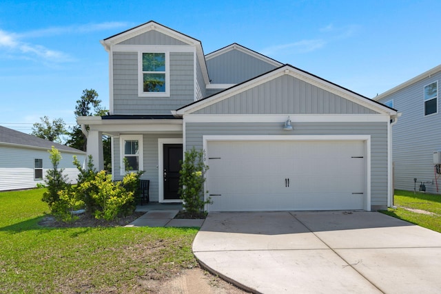 630 Jancus St, Charleston, SC 29414 - view of front of property with a garage, concrete driveway, board and batten siding, and a front yard