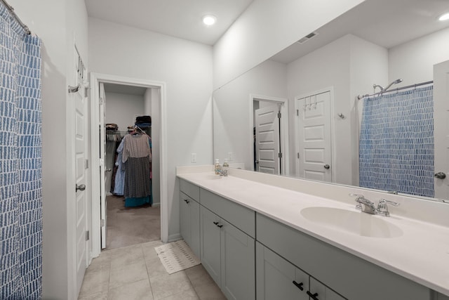 630 Jancus St, Charleston, SC 29414 - bathroom with a shower with curtain, double vanity, tile patterned floors, recessed lighting, and a spacious closet