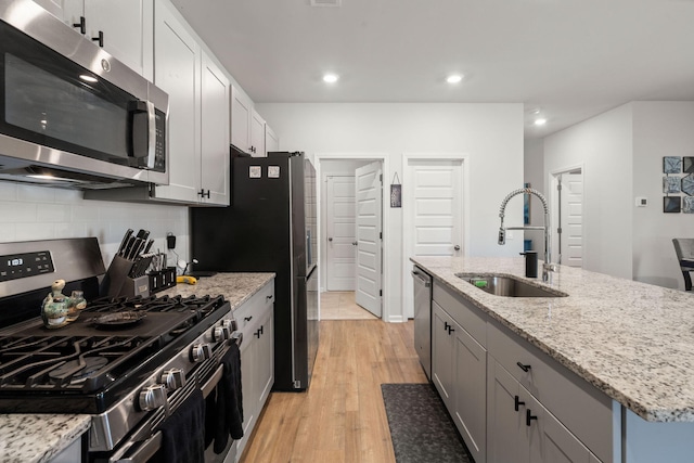 630 Jancus St, Charleston, SC 29414 - kitchen featuring appliances with stainless steel finishes, a sink, backsplash, recessed lighting, and light wood finished floors