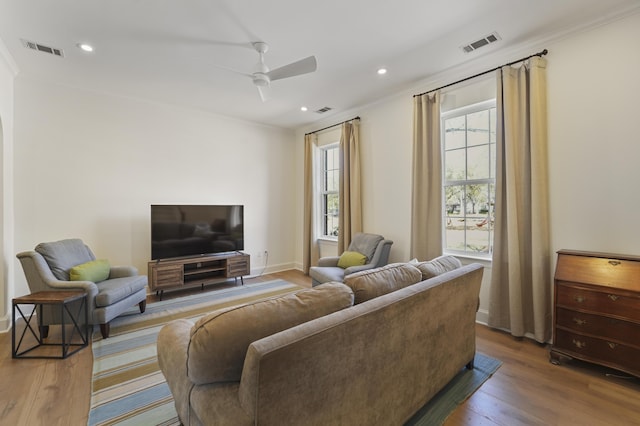 living area with recessed lighting, wood finished floors, visible vents, and ceiling fan