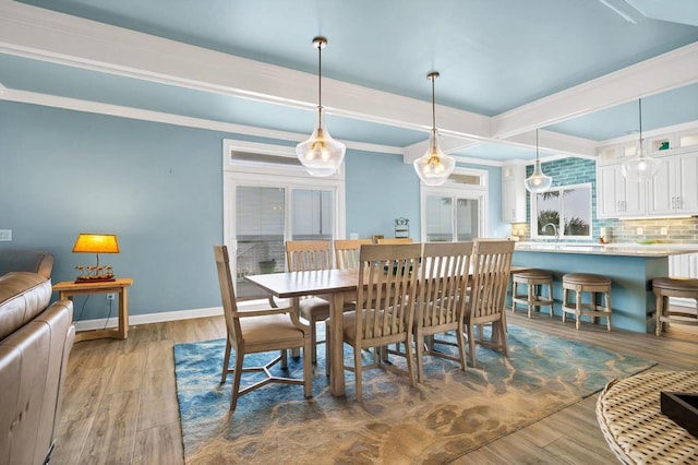 1404 Palmetto Blvd, Edisto Beach, SC 29438 - dining area featuring beamed ceiling, baseboards, and wood finished floors
