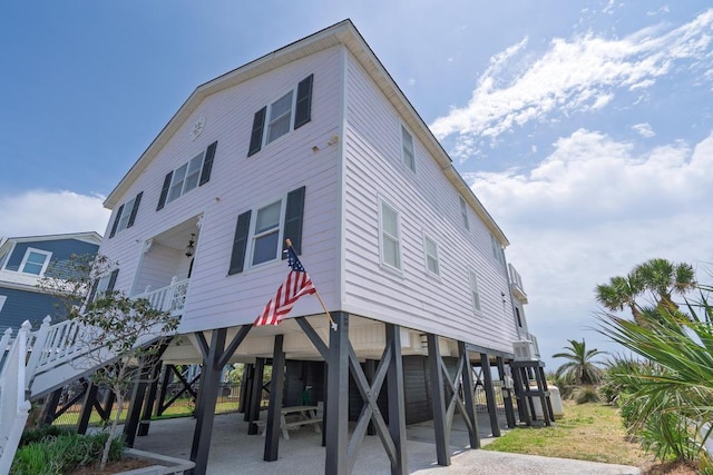 1404 Palmetto Blvd, Edisto Beach, SC 29438 - exterior space with stairway and a carport
