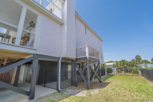 1404 Palmetto Blvd, Edisto Beach, SC 29438 - back of house featuring a lawn, a patio area, and fence
