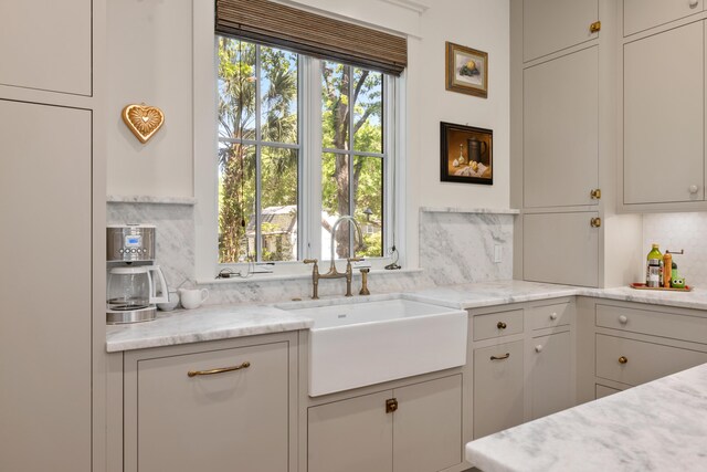 kitchen featuring a sink and backsplash