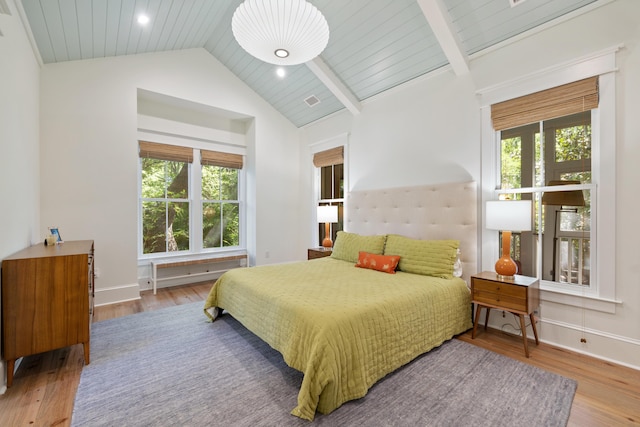 bedroom featuring recessed lighting, baseboards, wood finished floors, and lofted ceiling