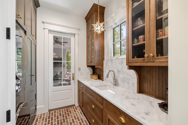 interior space with a sink and brick patterned floor