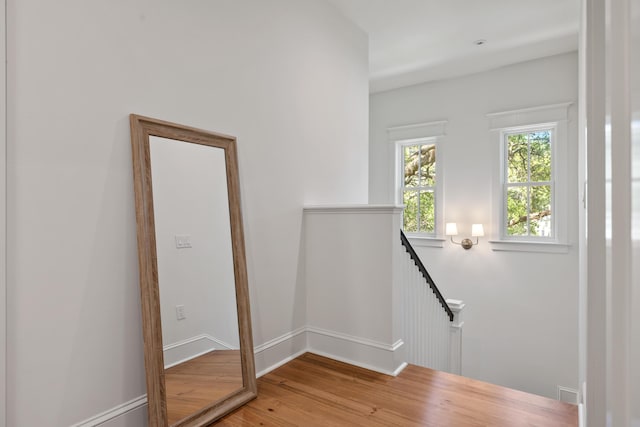stairs featuring baseboards and wood finished floors