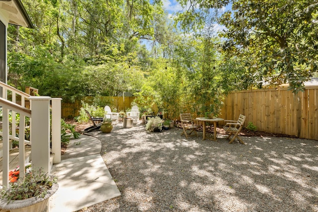 view of patio / terrace featuring fence