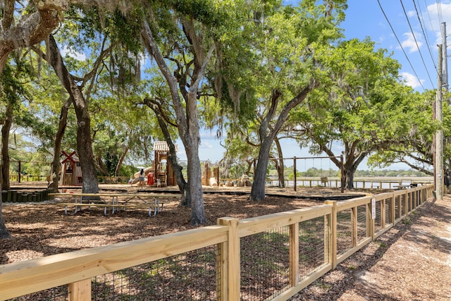 view of yard with fence and playground community