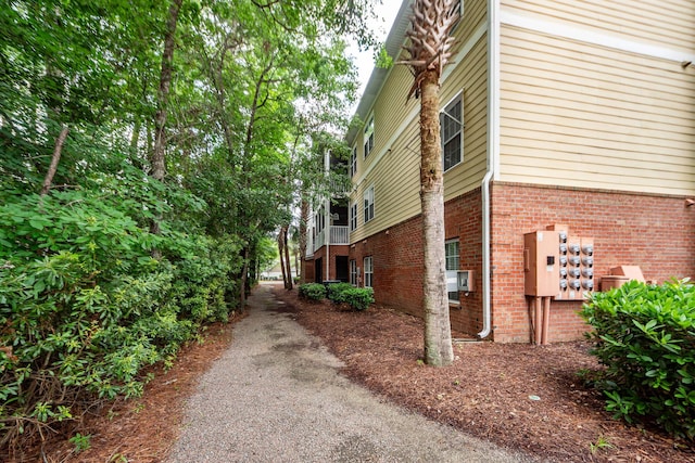 1121 Basildon Rd, Mount Pleasant, SC 29466 - view of side of property featuring brick siding