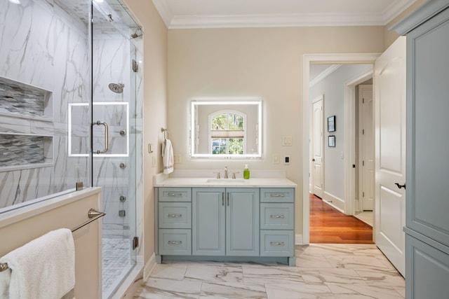 bathroom with vanity, crown molding, and walk in shower