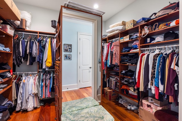 spacious closet with hardwood / wood-style floors