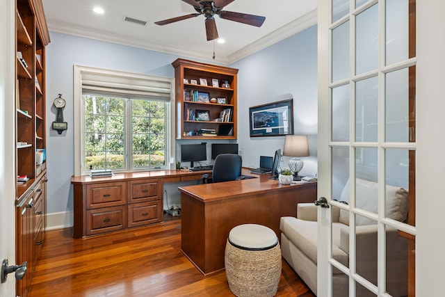 office space with ornamental molding, dark hardwood / wood-style floors, and ceiling fan