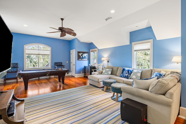 living room featuring lofted ceiling, hardwood / wood-style floors, and ceiling fan