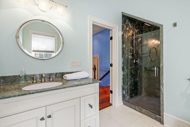 bathroom with vanity, tile patterned floors, and walk in shower