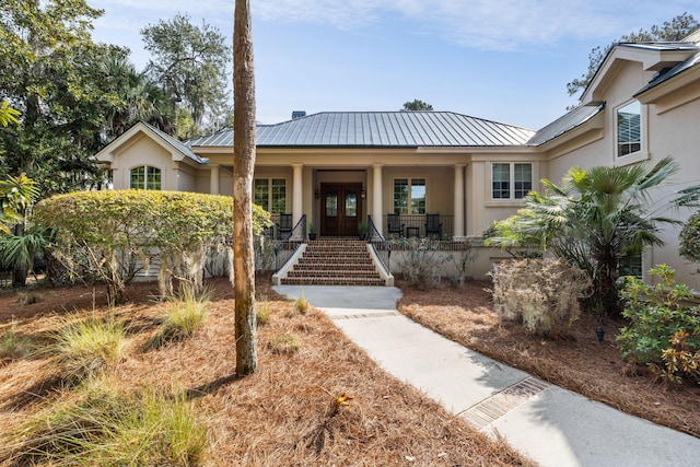 view of front of home featuring a porch and french doors