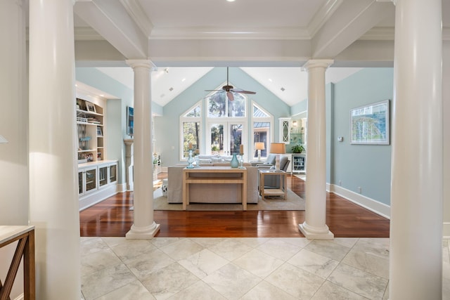 dining space with built in shelves, ornamental molding, ceiling fan, and ornate columns