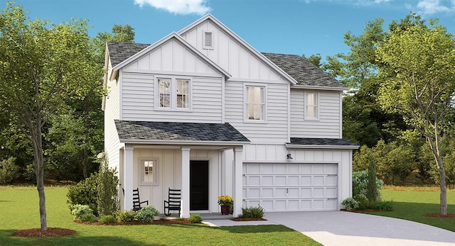 view of front of house featuring a front yard and a garage