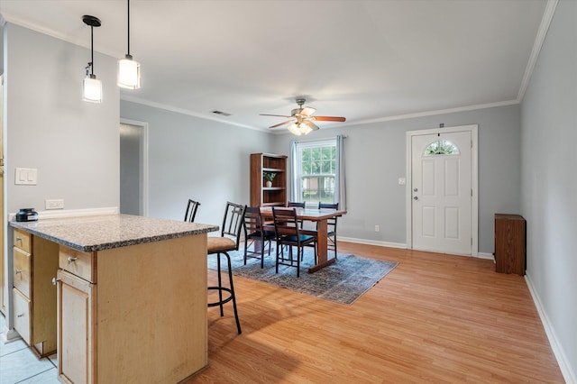 14 Aldene Ave, Goose Creek, SC 29445 - kitchen with ceiling fan, light wood-type flooring, a kitchen breakfast bar, crown molding, and baseboards