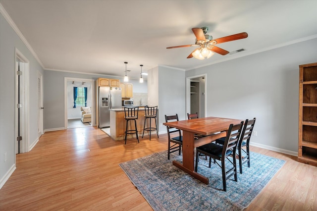 14 Aldene Ave, Goose Creek, SC 29445 - dining area with light wood-style flooring, a ceiling fan, baseboards, and ornamental molding