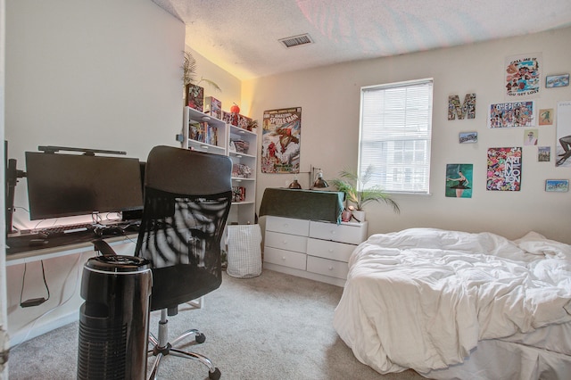 carpeted bedroom with a textured ceiling