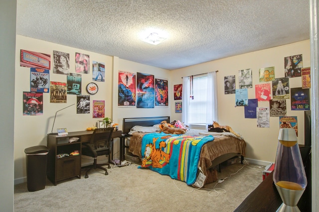 carpeted bedroom featuring a textured ceiling