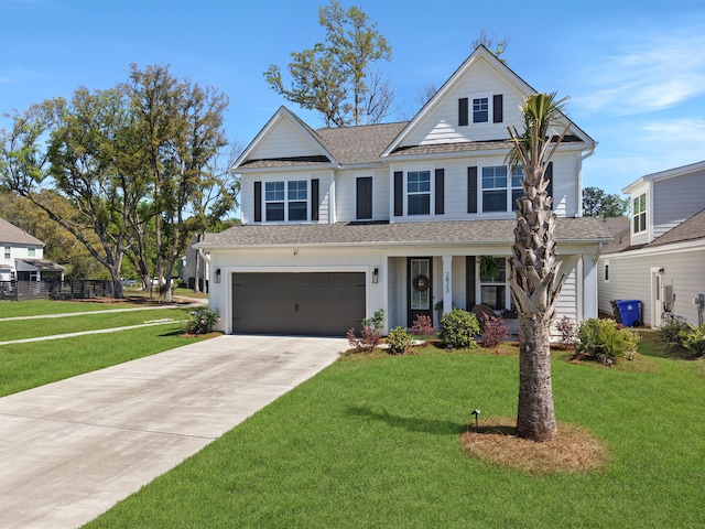 view of front of property featuring roof with shingles, driveway, a garage, and a front lawn