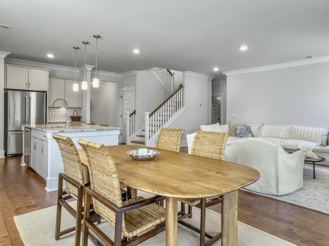 dining area featuring dark wood-style flooring, stairway, recessed lighting, and crown molding