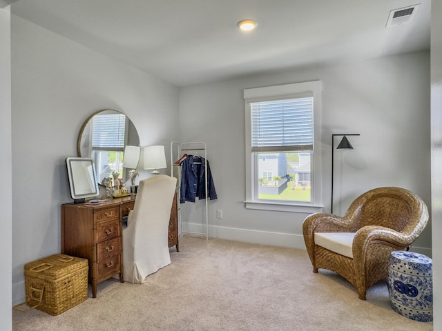 office area featuring visible vents, baseboards, and carpet flooring