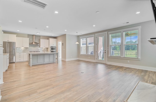 357 Parish Farms Dr, Summerville, SC 29486 - unfurnished living room with light wood-type flooring and recessed lighting