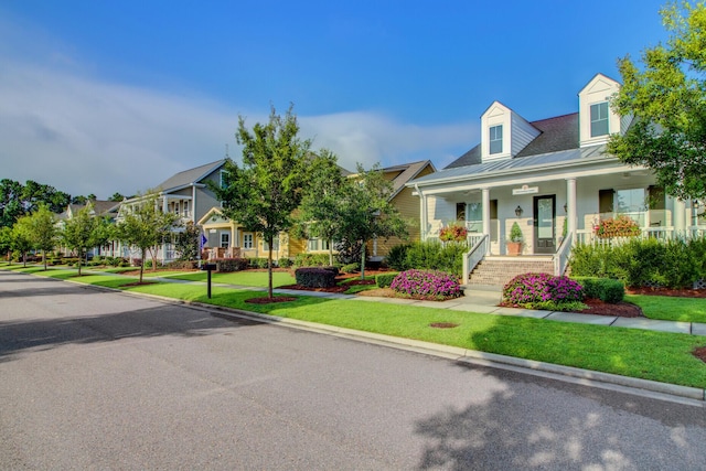 357 Parish Farms Dr, Summerville, SC 29486 - view of front facade featuring a porch, a front yard, a residential view, a metal roof, and a standing seam roof