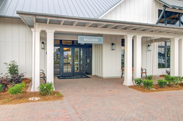 357 Parish Farms Dr, Summerville, SC 29486 - property entrance with french doors, a metal roof, a standing seam roof, and board and batten siding