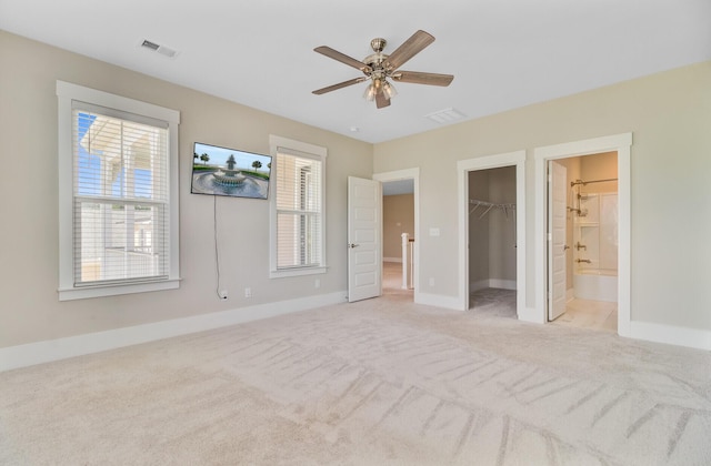 357 Parish Farms Dr, Summerville, SC 29486 - unfurnished bedroom with light carpet, a spacious closet, ensuite bathroom, a ceiling fan, and a closet