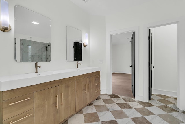 bathroom featuring vanity and an enclosed shower