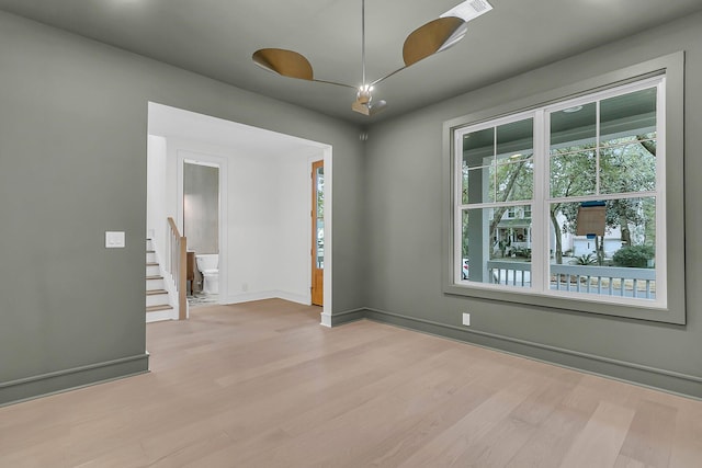 spare room featuring light wood-type flooring